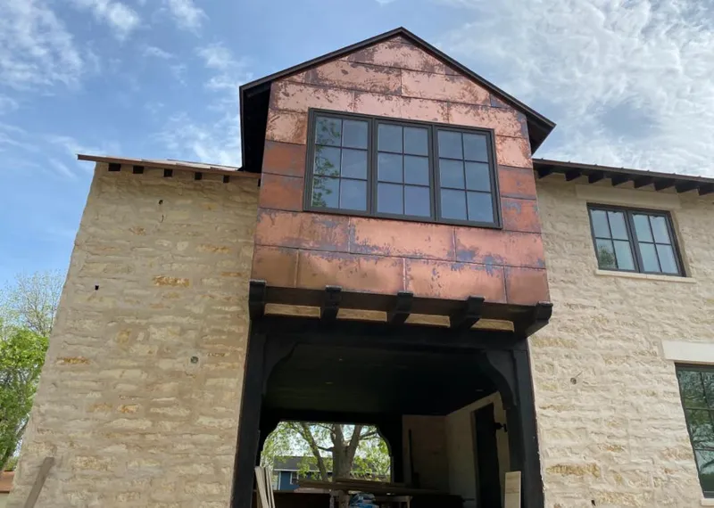 Copper metal panel facade on a stone building for Skylight Installation in Fairfax